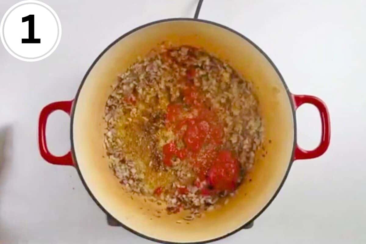 Red onions, spices, and sriracha in cooking pot.