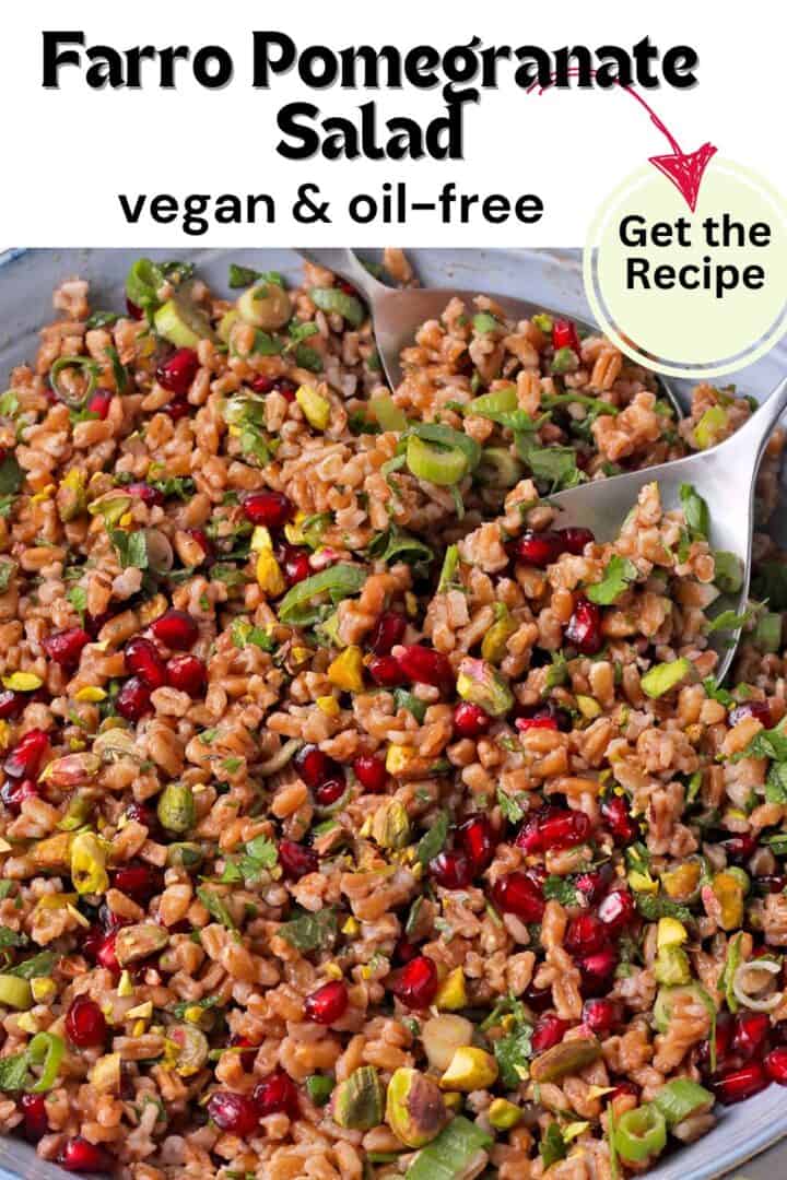 A bowl of farro pomegranate salad with pistachios, green onions, and parsley with text overlay of recipe title on photo.