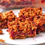 Raspberry oatmeal bars on a plate.