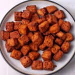 A plate of miso tofu cubes.