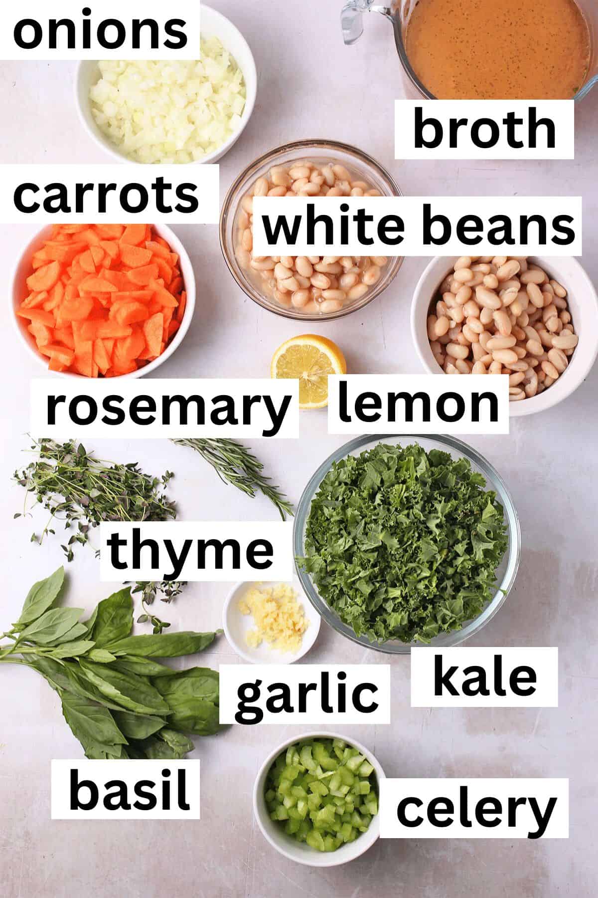 The ingredients for Tuscan white bean soup with kale with labels.