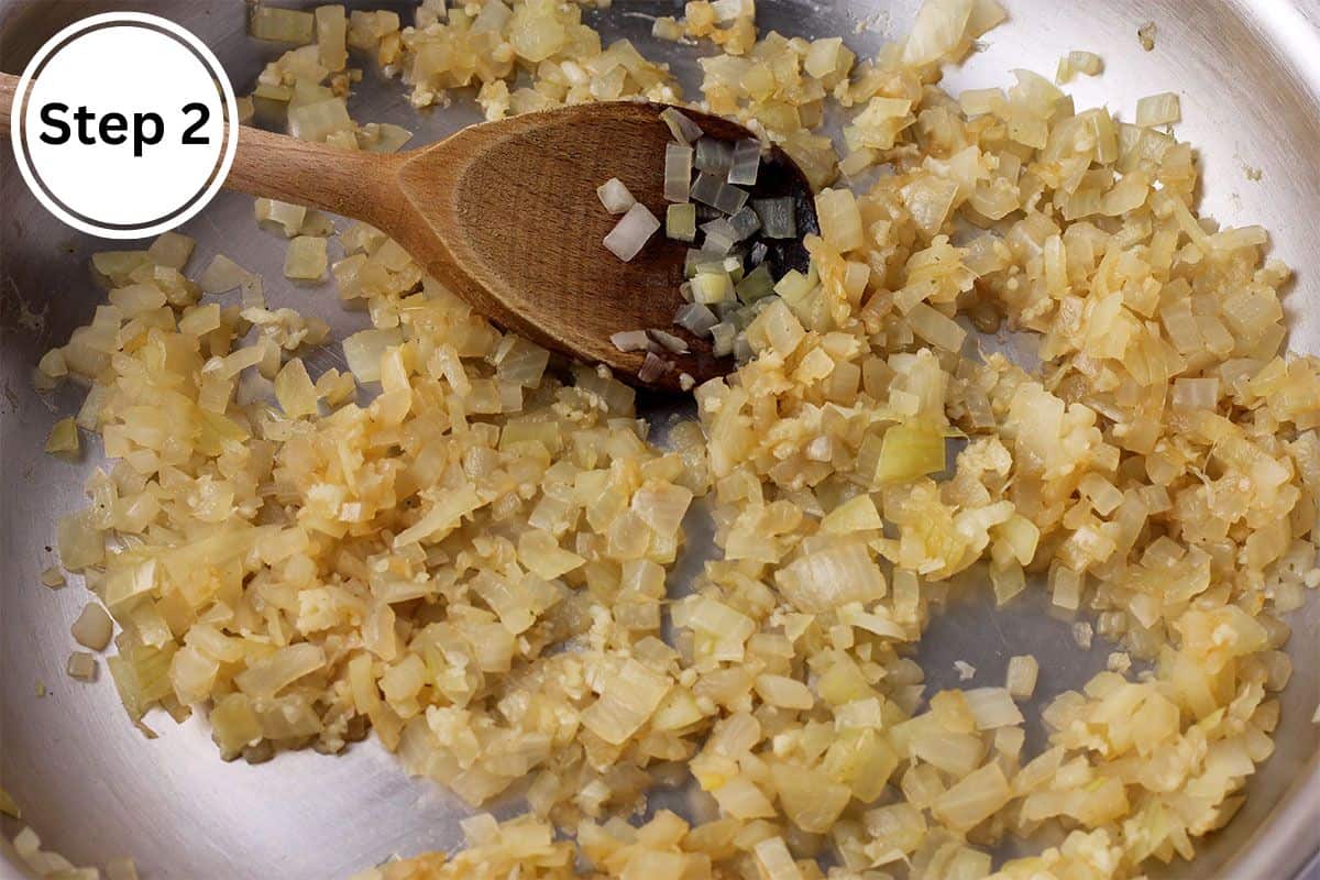 Diced onions are cooked in a frying pan.