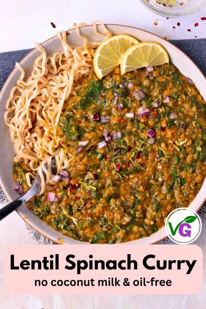 A Pin for lentil spinach curry with curry in a bowl topped with lemon wedges and chopped red onion and noodles.