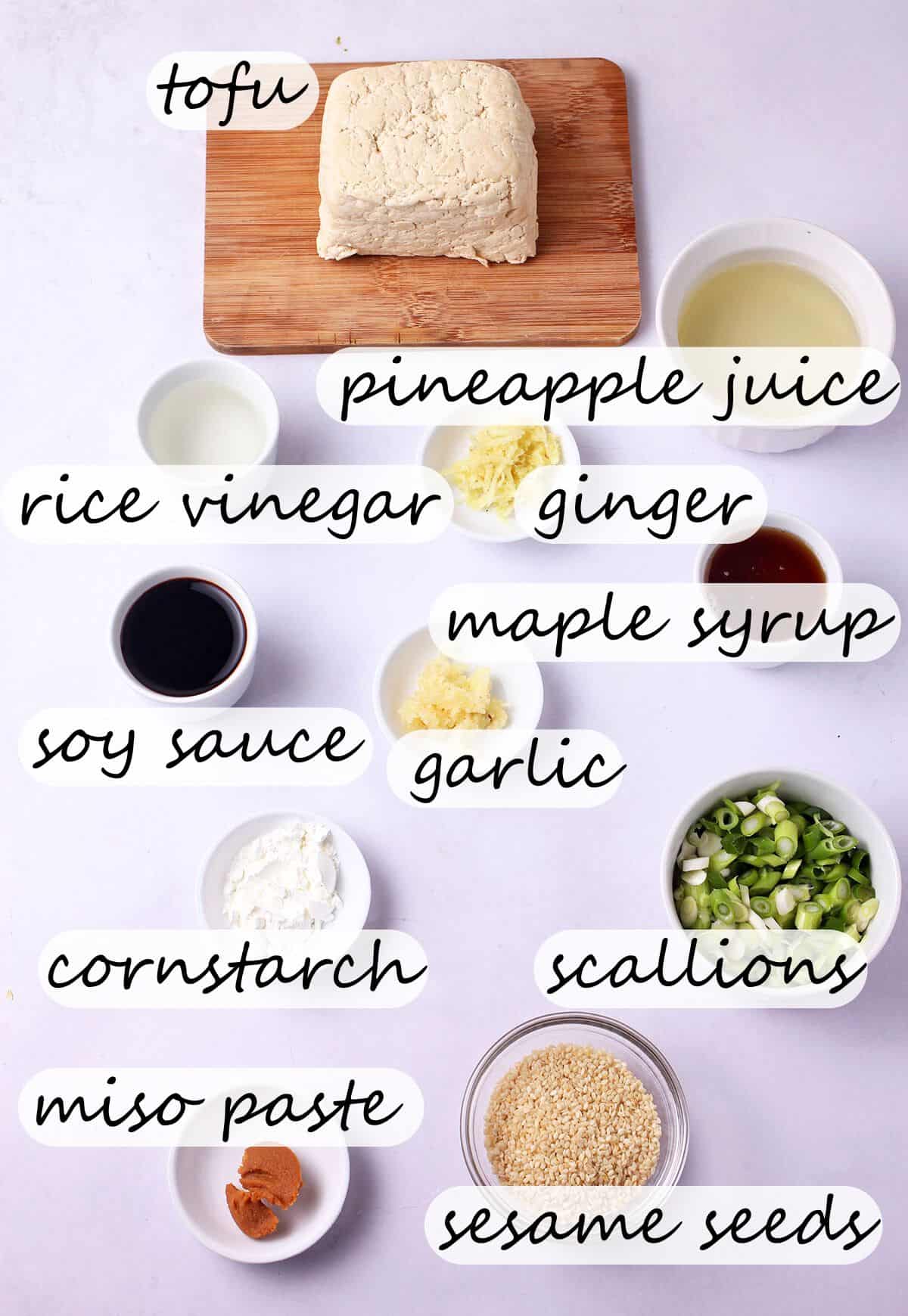The ingredients for crispy tofu and homemade teriyaki sauce with labels over the ingredients.