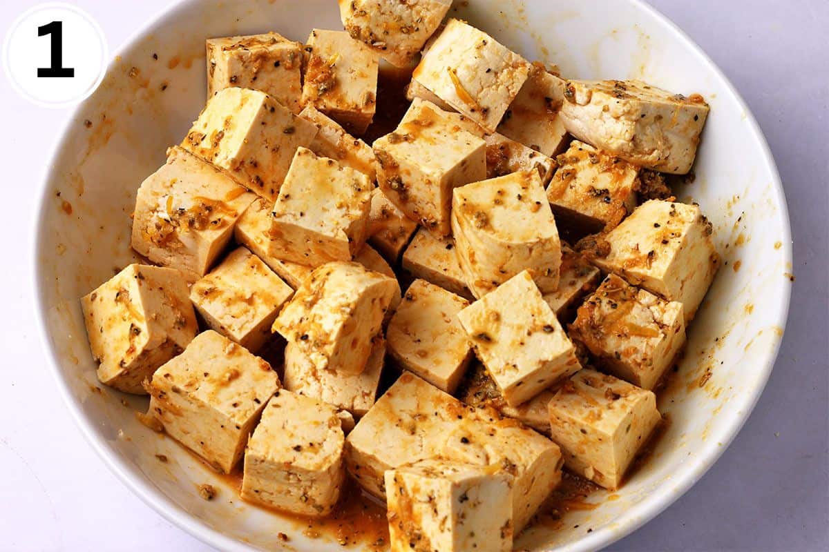 Tofu cubes covered in lemon pepper marinade.